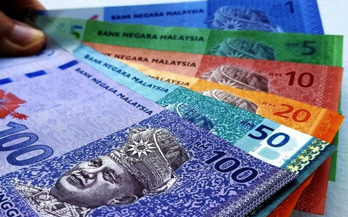 Najib takes swipe at faltering ringgit