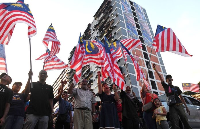 Sight to behold: Thousands of Jalur Gemilang fly proudly in Penang's Kg Melayu